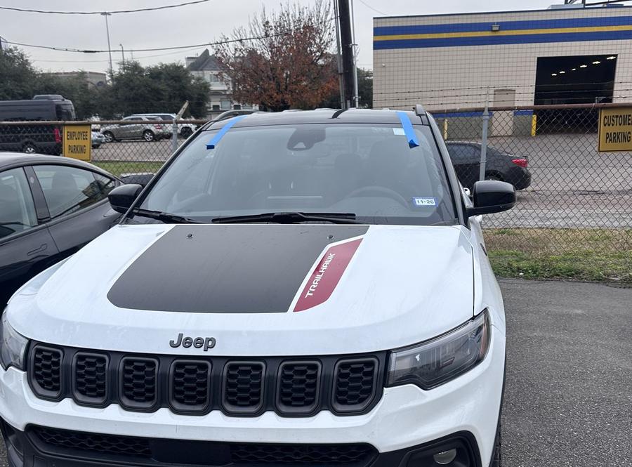 White Jeep Compass Trailhawk with a new windshield